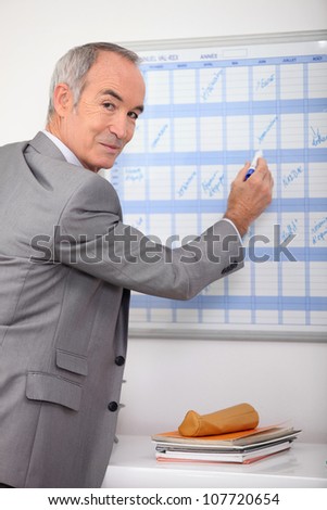 Man writing on slate