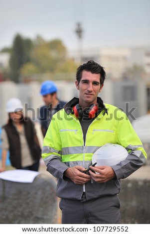 Foreman surveying construction