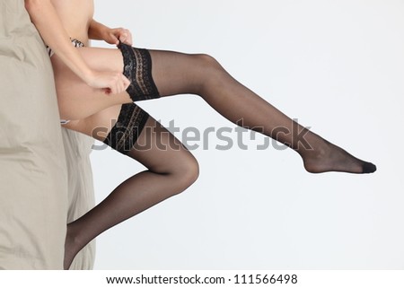 A cropped picture of a woman legs.