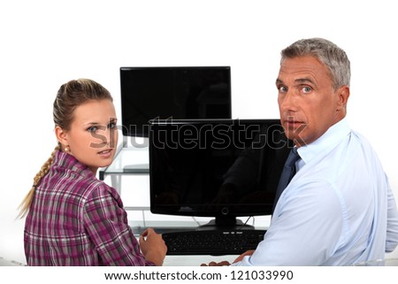 teacher and student in front of computer