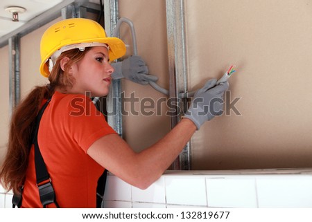 Similar – Image, Stock Photo Professional female master fixing wheel of motorbike