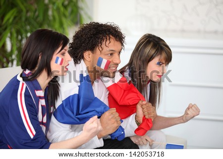 French supporter watching TV