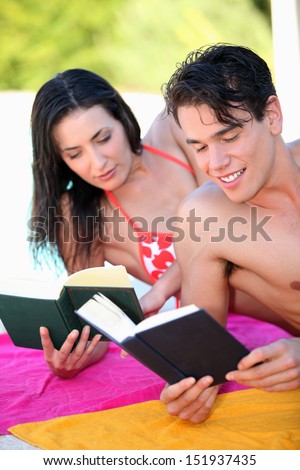 couple reading on the beach