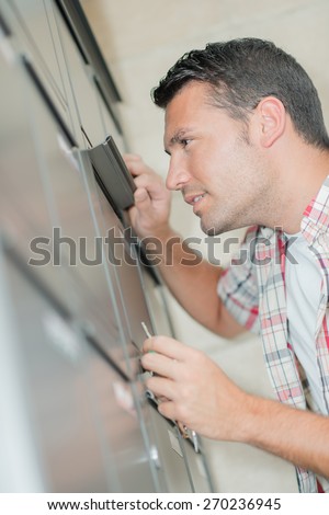 Man checking his letter box