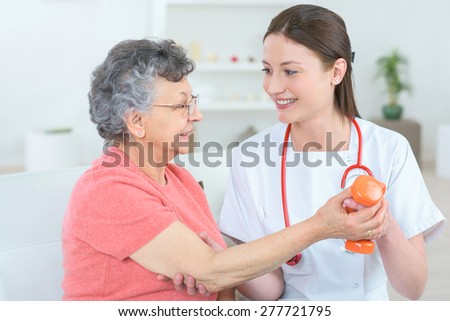 Senior woman with hand weights