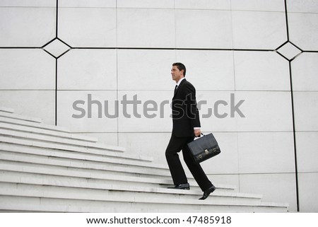 Businessman going up stairs