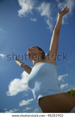Woman stretching arms up in the air