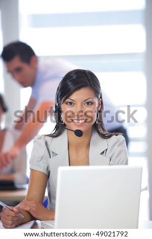 Portrait of pretty business woman with headset