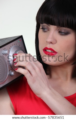 Portrait of a woman with radio