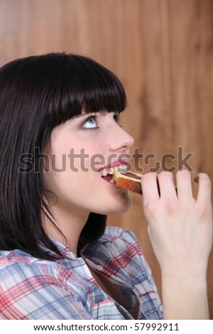 Portrait of a woman eating cake