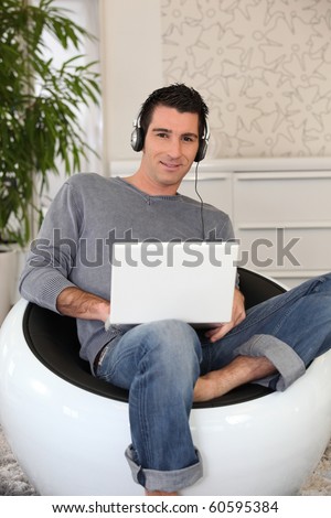 Man listening to music on computer