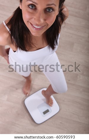 Woman standing on Scales