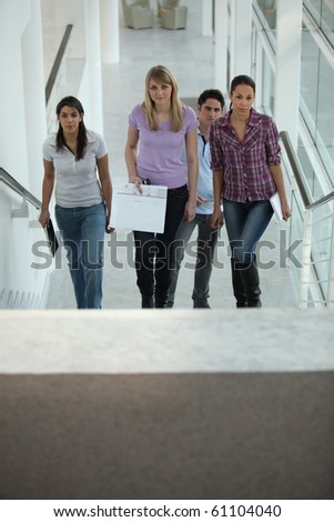 Group of young people climbing stairs