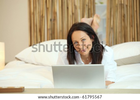 Relaxed woman in front of a laptop computer