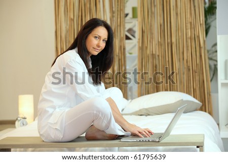 Relaxed woman in front of a laptop computer