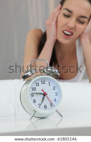 Young Brown-haired woman waking up