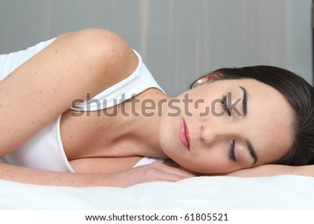Young brown-haired woman asleep
