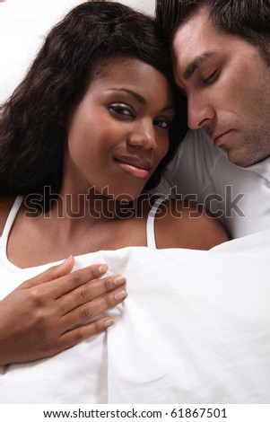 Woman laid near a sleeping man