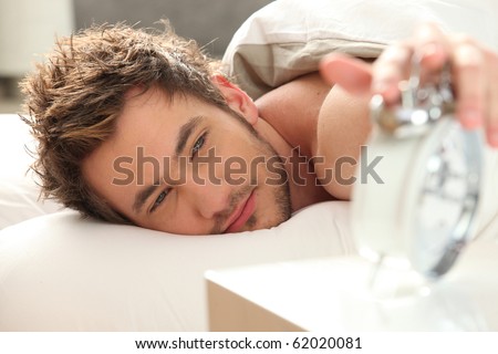 Young brown-haired man waking