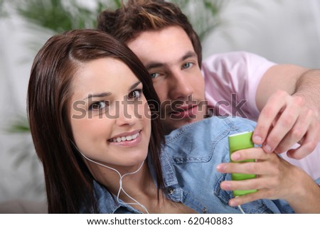 Relaxed couple listening to music