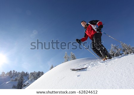 Young man on skis in snow