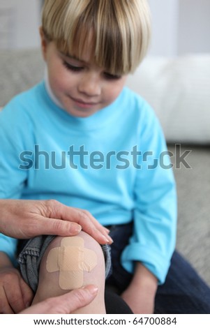 Boy with a bandage on the knee
