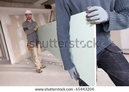 Workers in a house under construction
