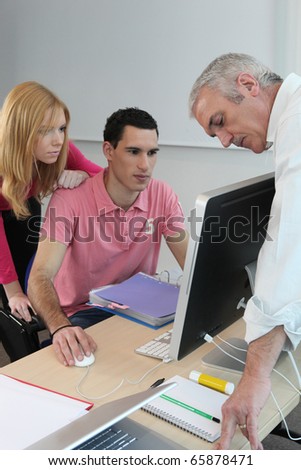 Students and professor in computer course
