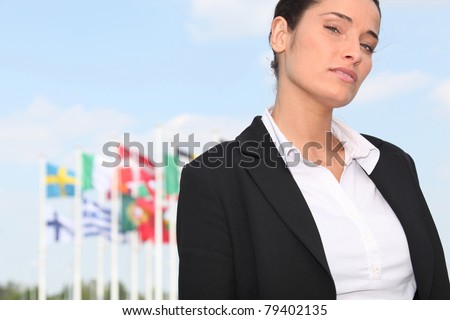 woman standing in front of European flags