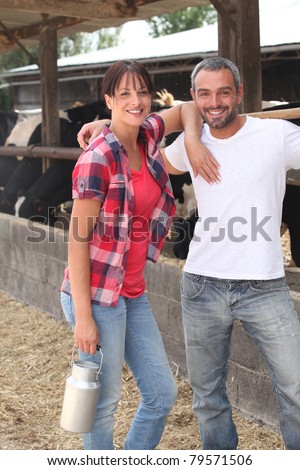 Farming couple with cows