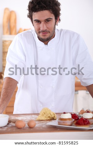 Male baker making sweet cakes