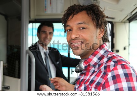 Man paying for bus ticket
