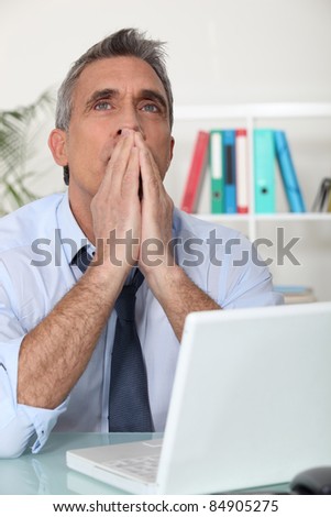 Man thinking at his computer