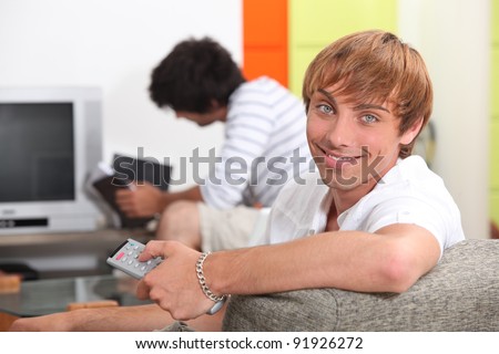 Two teenagers getting ready to watch a film
