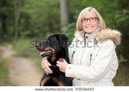 Woman taking dog for a walk