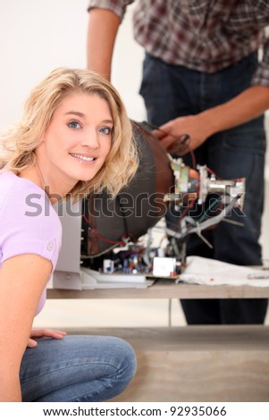 technician repairing a television