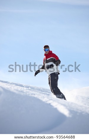 Man snowboarding alone