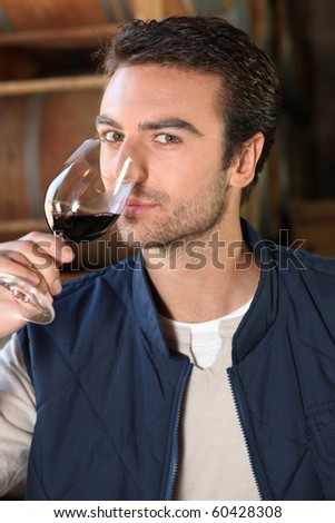 Winegrower with glass of red wine Stockfoto © 