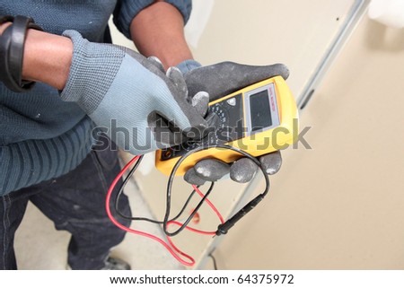 Electrician with a multimeter Photo stock © 