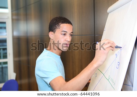 Student writing on the blackboard in classroom Photo stock © 