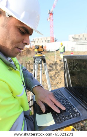 Worker in front of a laptop computer on site Photo stock © 