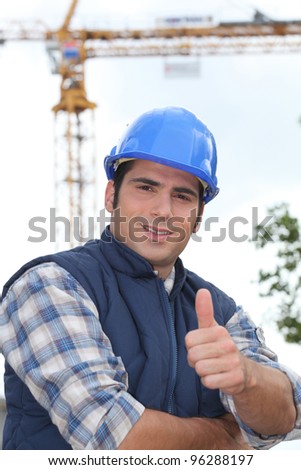 A construction worker giving the thumb up.