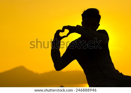 Man in silhouette make some love to his girl friend