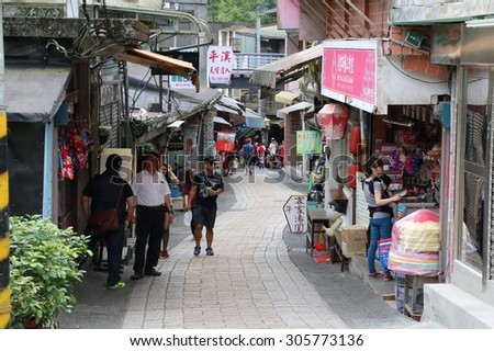 PINGXI, TAIWAN - APRIL 18, 2015: Tourist at Pingxi Old Street, Taiwan on 18 Apr, 2015. Pingxi, northern of Taipei, is a popular destination for one day trip by train to visit local market and lantern.