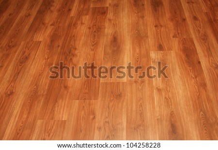Close up detail of a beautiful wooden brown laminated floor