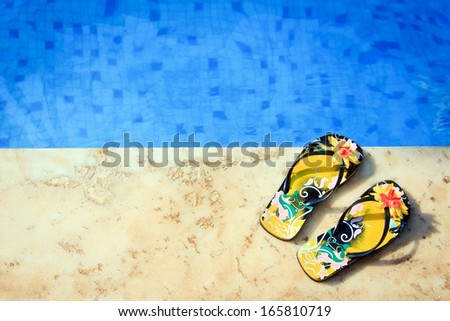 woman flip-flops near clear pool