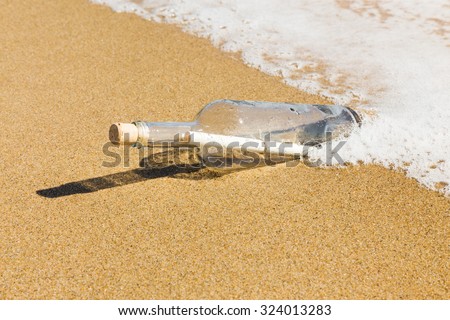 Message in a bottle on the beach.