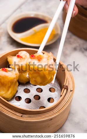 dim sum in bamboo steam containers/chinese food in restaurant
