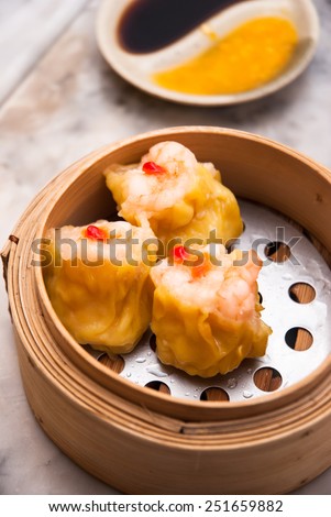 dim sum in bamboo steam containers/chinese food in restaurant