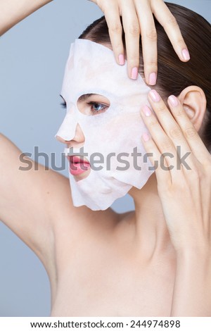 Beauty portrait with a mask sheet